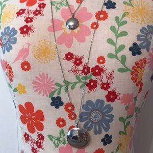 Silver tone necklaces.